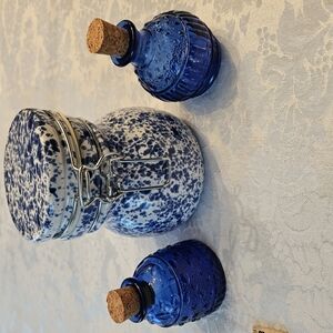 Blue and White Ceramic Jar with Corked Bottles